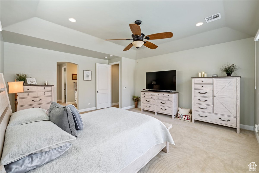 Bedroom featuring light colored carpet, arched walkways, recessed lighting, baseboards, and visible vents