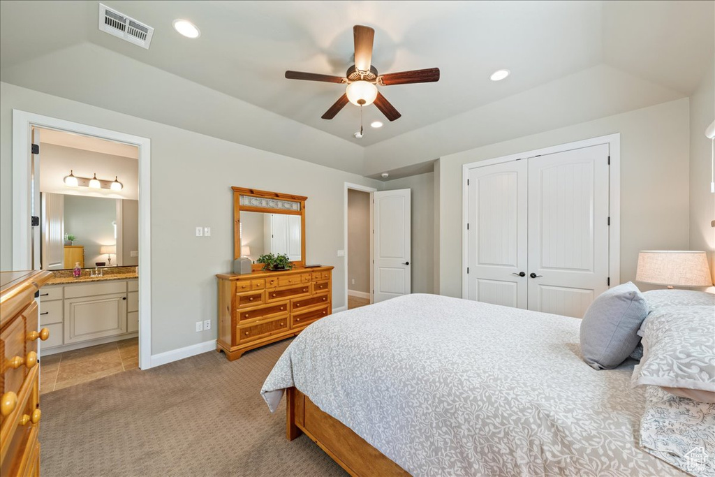 Bedroom featuring connected bathroom, light colored carpet, recessed lighting, visible vents, and a closet