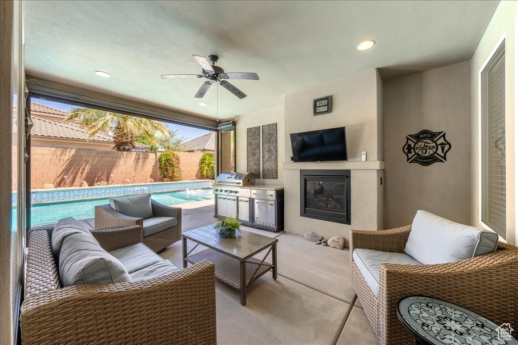 View of patio with ceiling fan, grilling area, a fenced backyard, an outdoor hangout area, and a fenced in pool