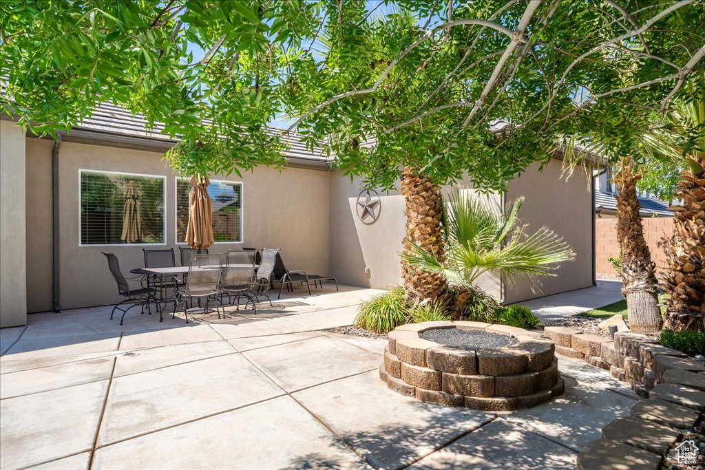 View of patio / terrace featuring outdoor dining area and an outdoor fire pit