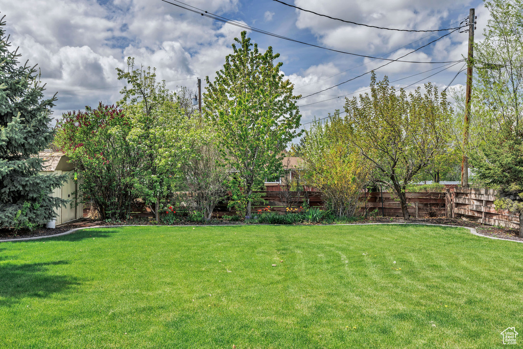 View of yard featuring fence