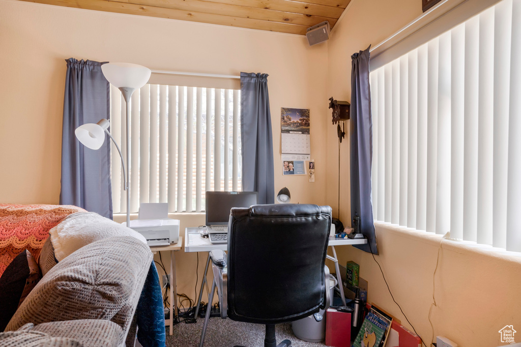 Office area featuring wooden ceiling and a healthy amount of sunlight