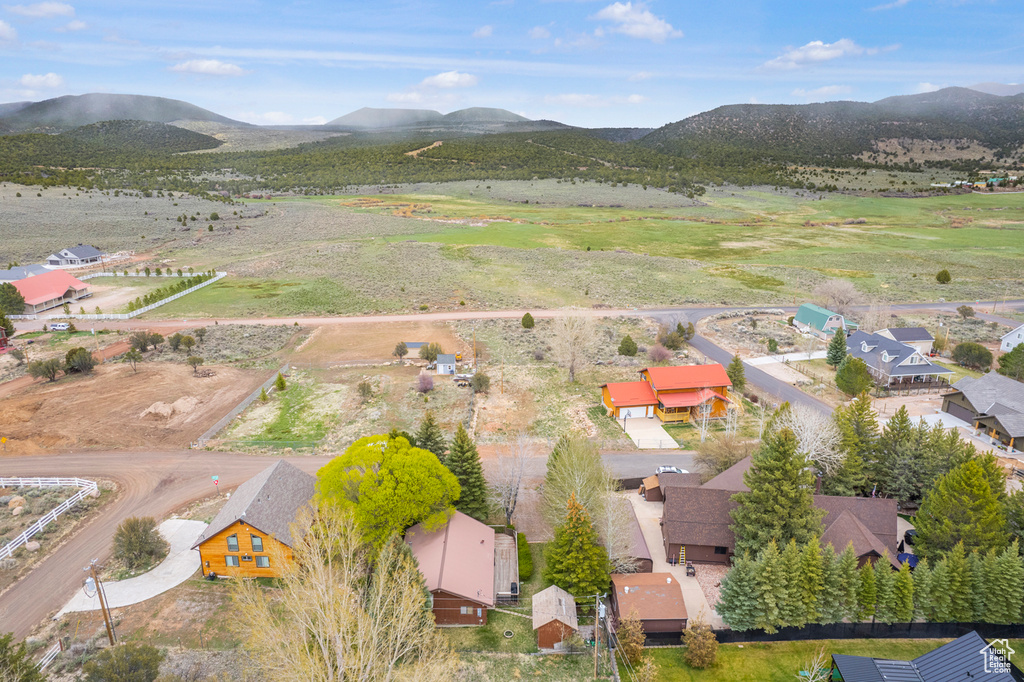 Birds eye view of property with a mountain view and a rural view
