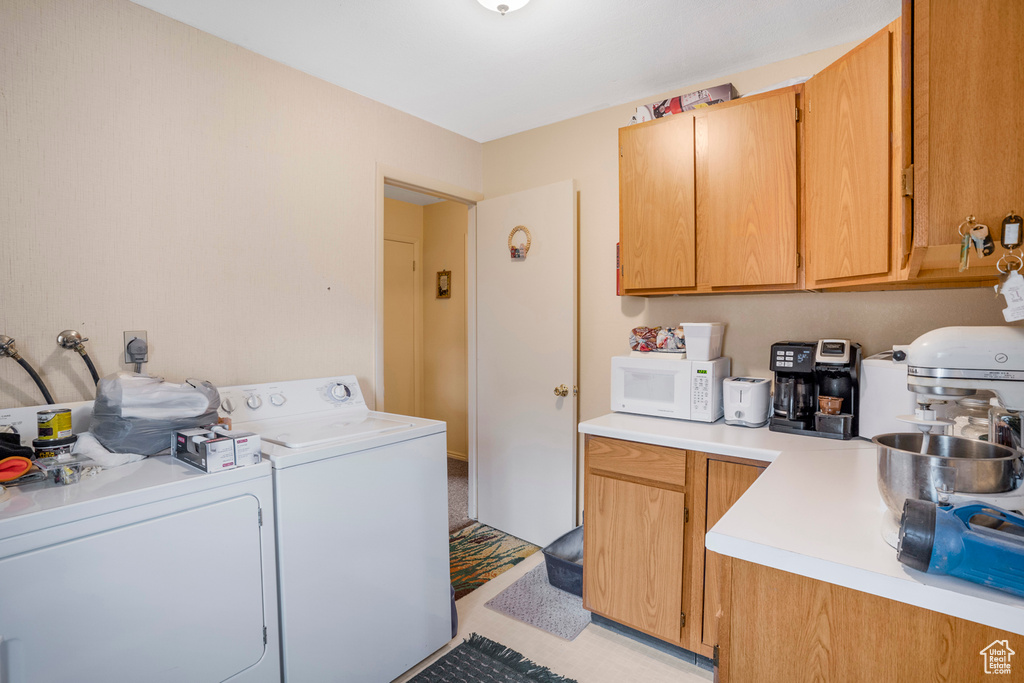 Washroom with separate washer and dryer and laundry area
