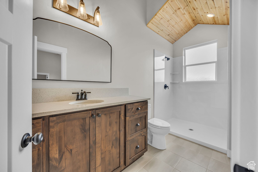 Bathroom featuring wood ceiling, walk in shower, vanity, toilet, and lofted ceiling