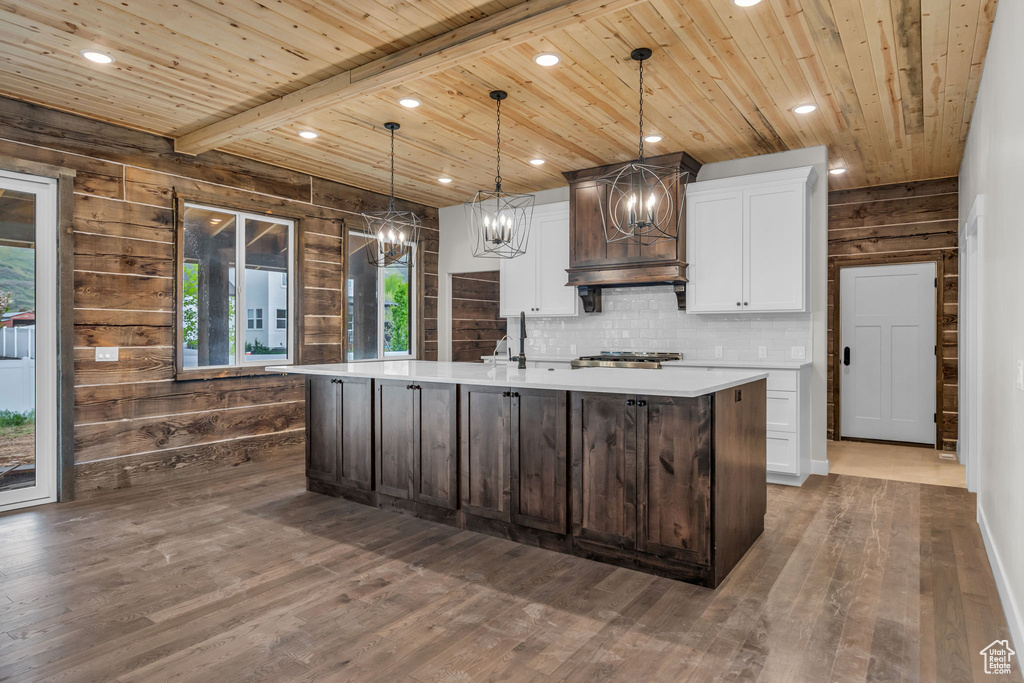 Kitchen featuring recessed lighting, light countertops, wood ceiling, and a chandelier