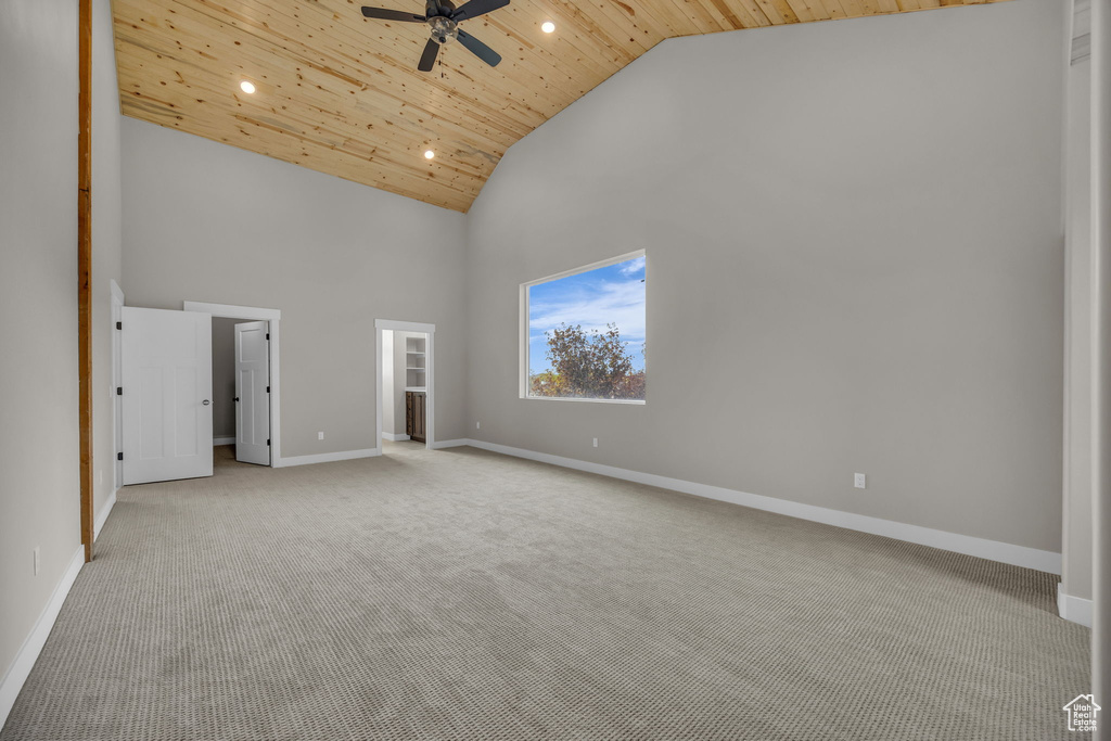 Unfurnished bedroom with recessed lighting, high vaulted ceiling, light colored carpet, and wood ceiling