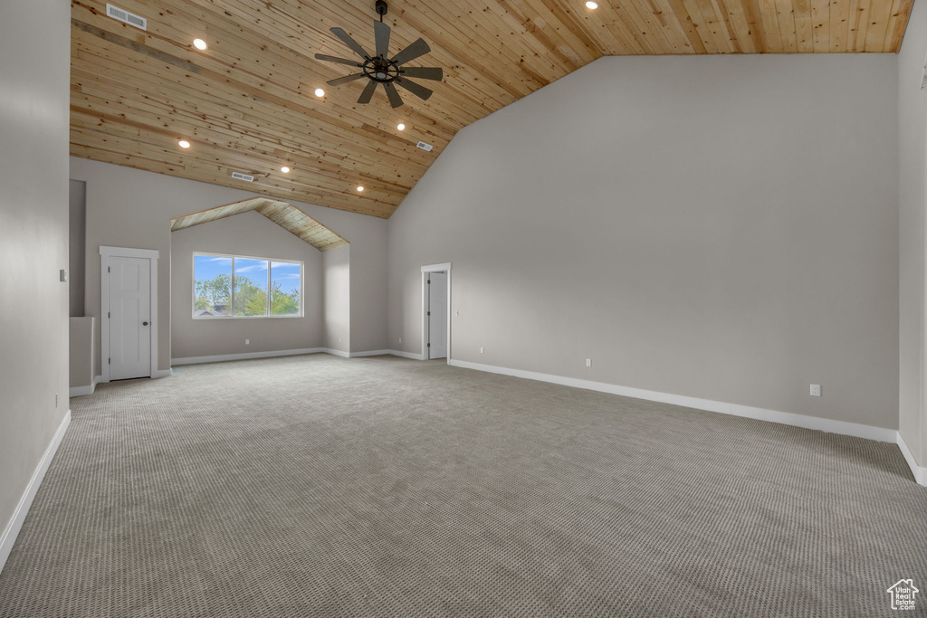 Unfurnished living room with carpet floors, recessed lighting, wood ceiling, and baseboards