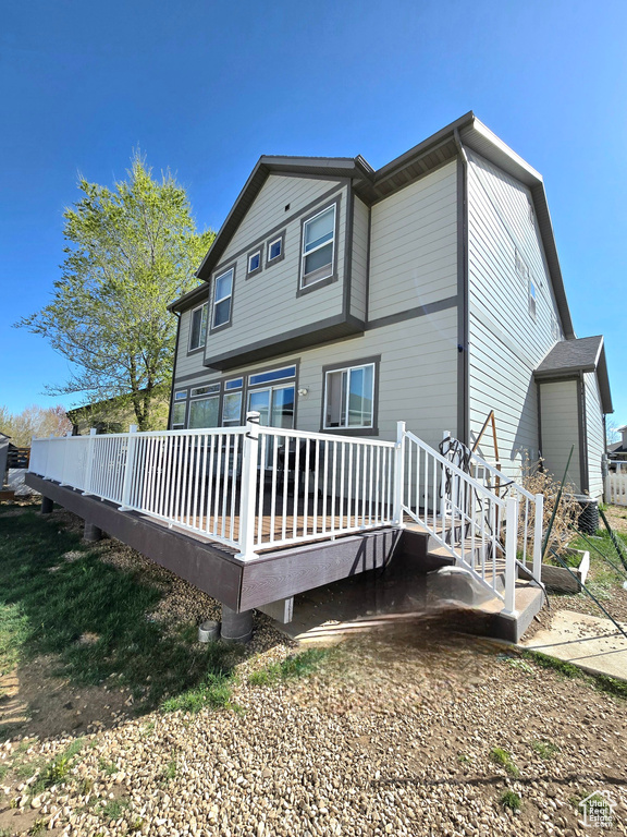 Back of house featuring a deck