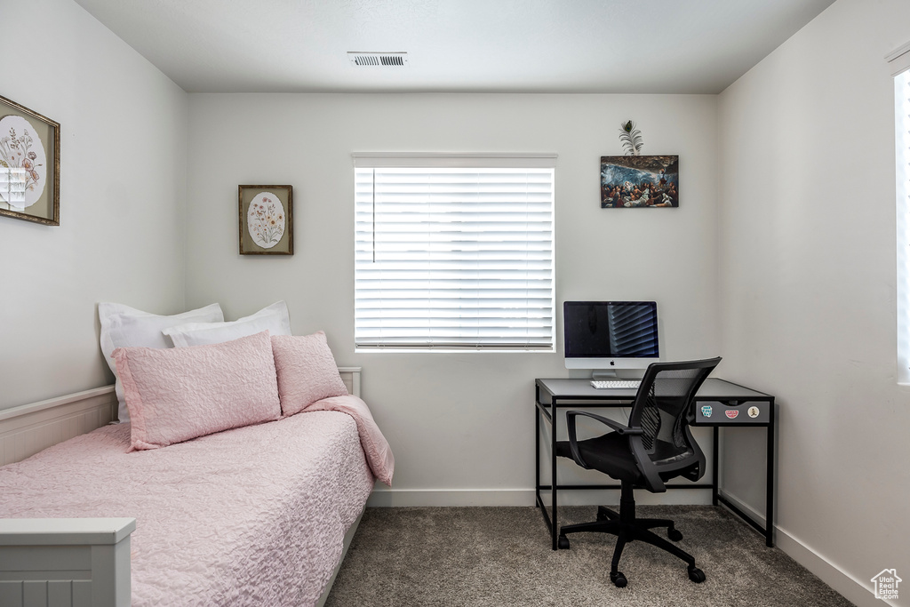 Bedroom featuring baseboards, carpet, and visible vents