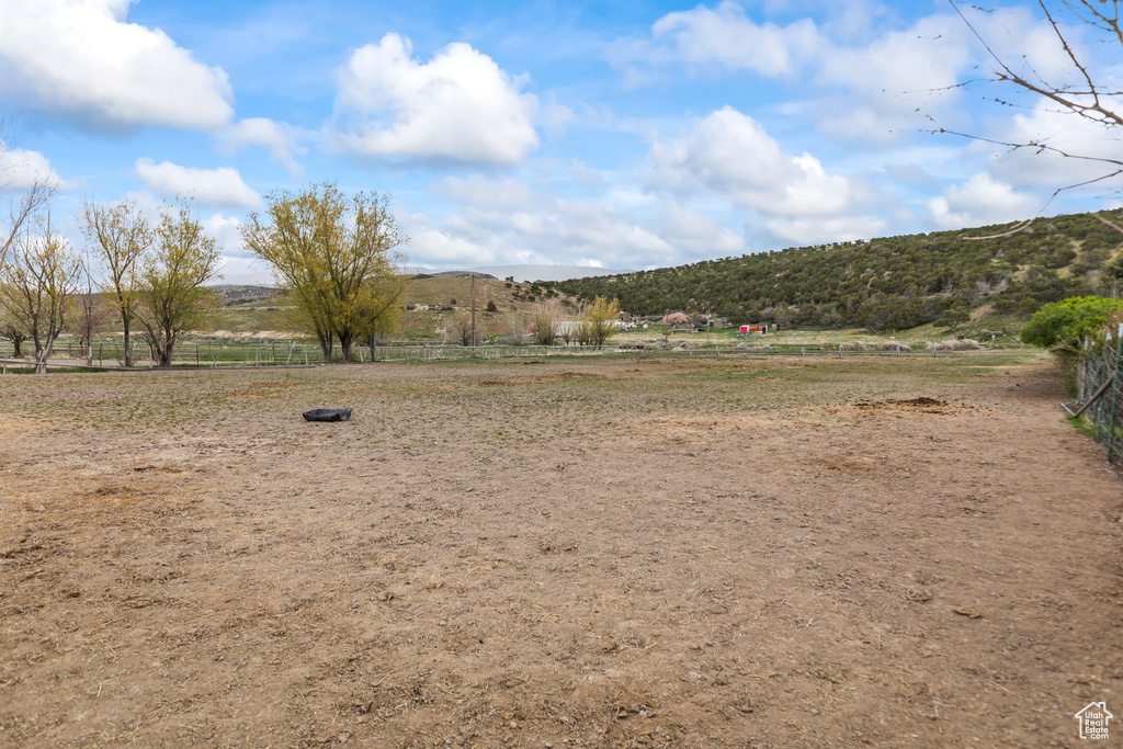 View of yard featuring a mountain view and a rural view