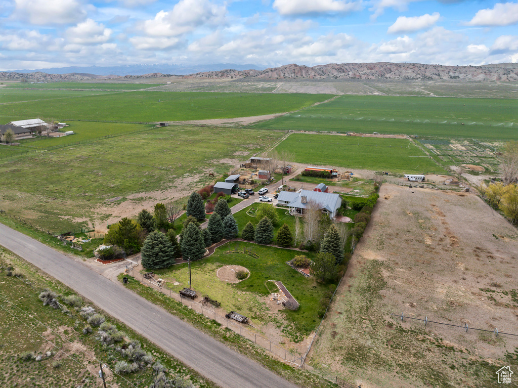 Birds eye view of property featuring a mountain view and a rural view
