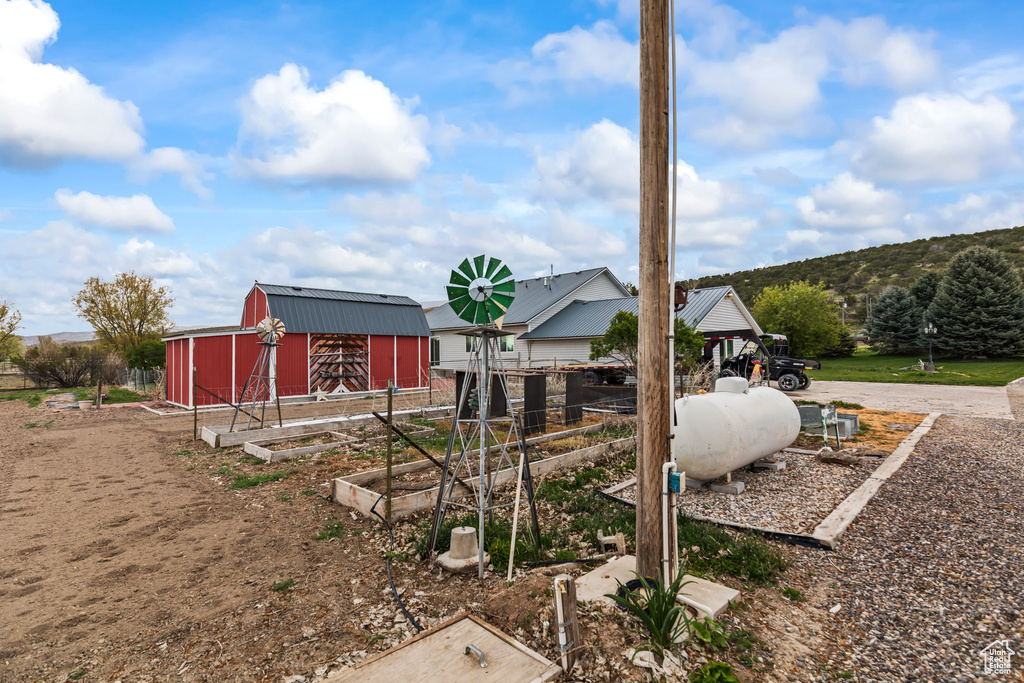 Exterior space with fence and an outbuilding