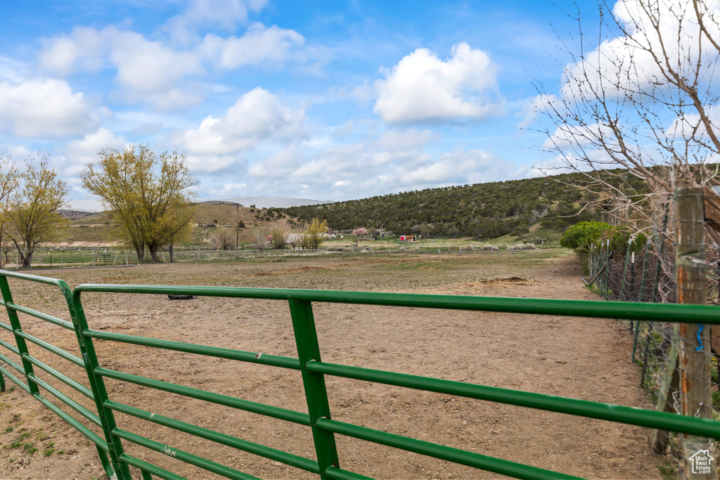 View of gate featuring a mountain view and a rural view