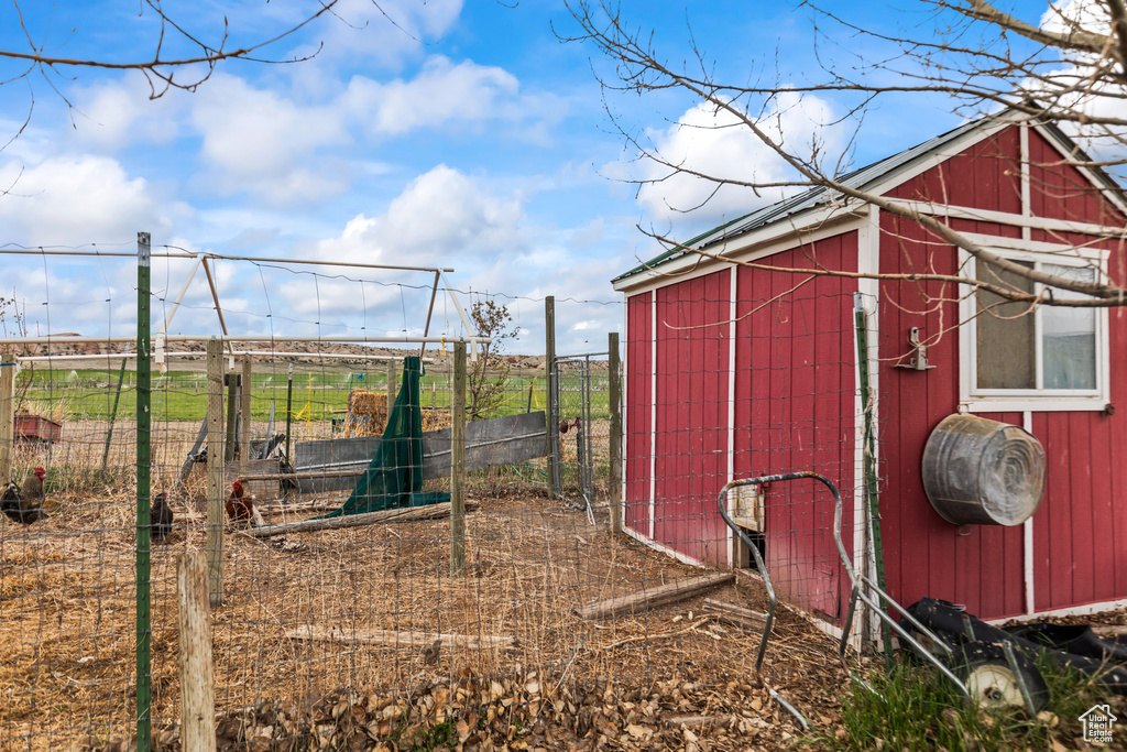 View of poultry coop featuring fence