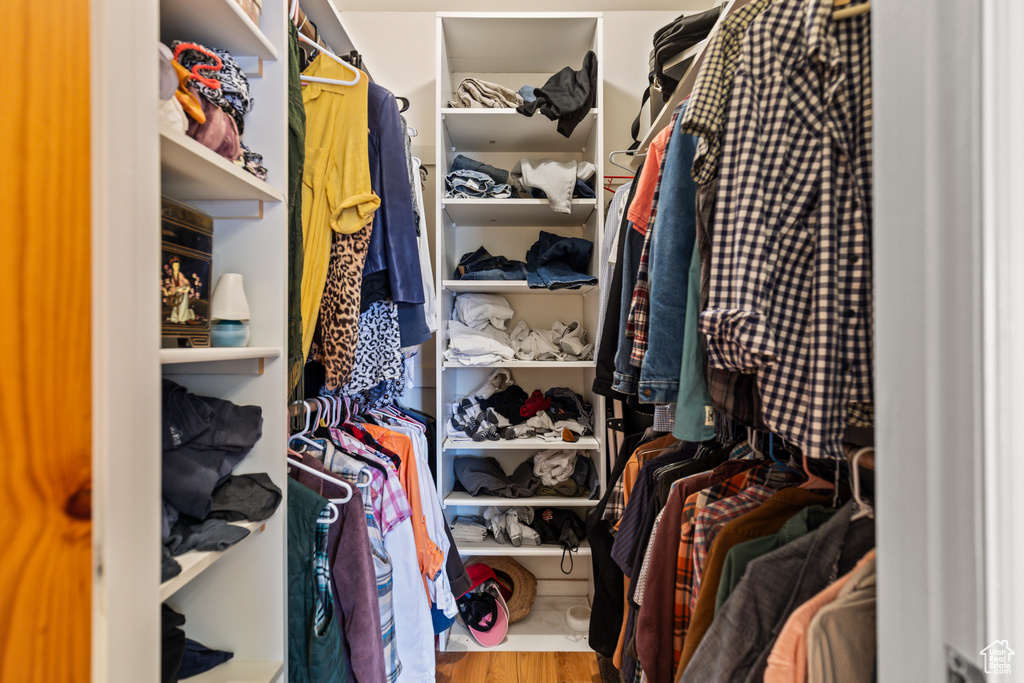 Walk in closet featuring wood finished floors