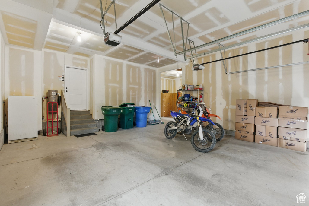 Garage featuring a garage door opener