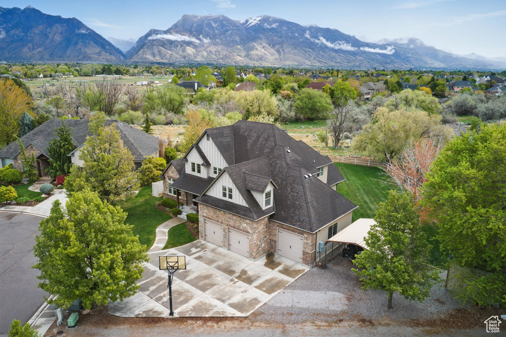 Birds eye view of property with a mountain view