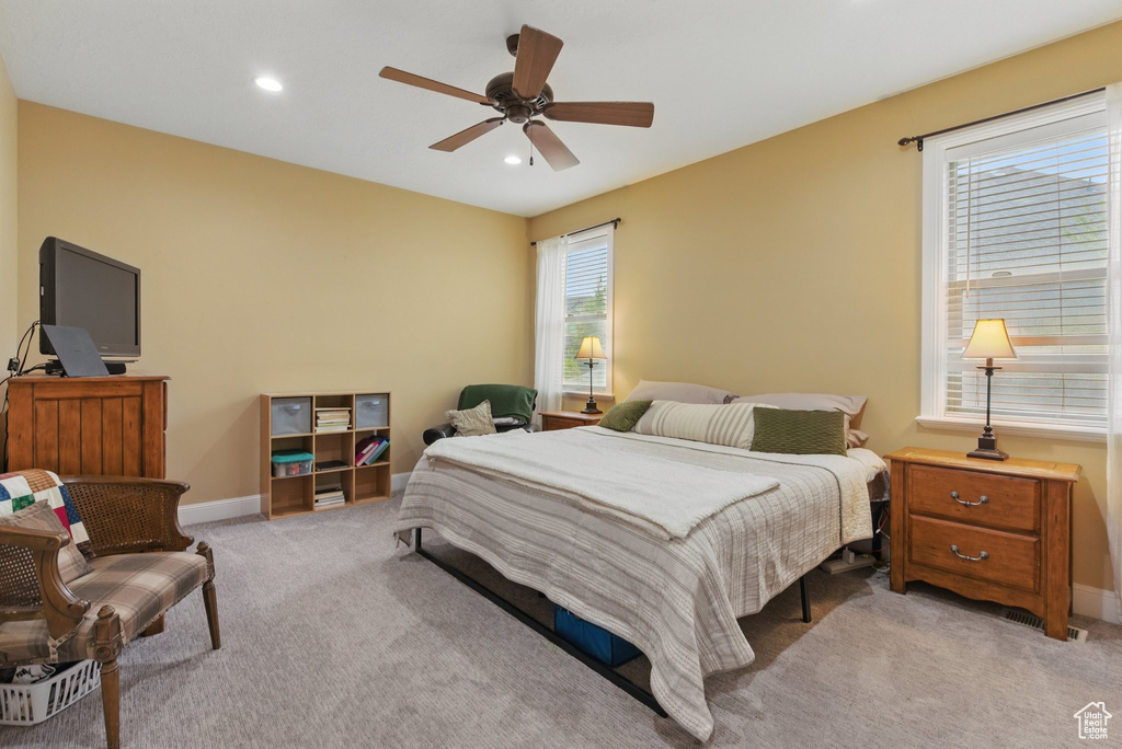 Bedroom featuring recessed lighting, a ceiling fan, baseboards, and light carpet