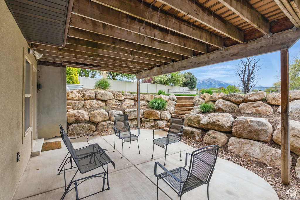 View of patio with fence