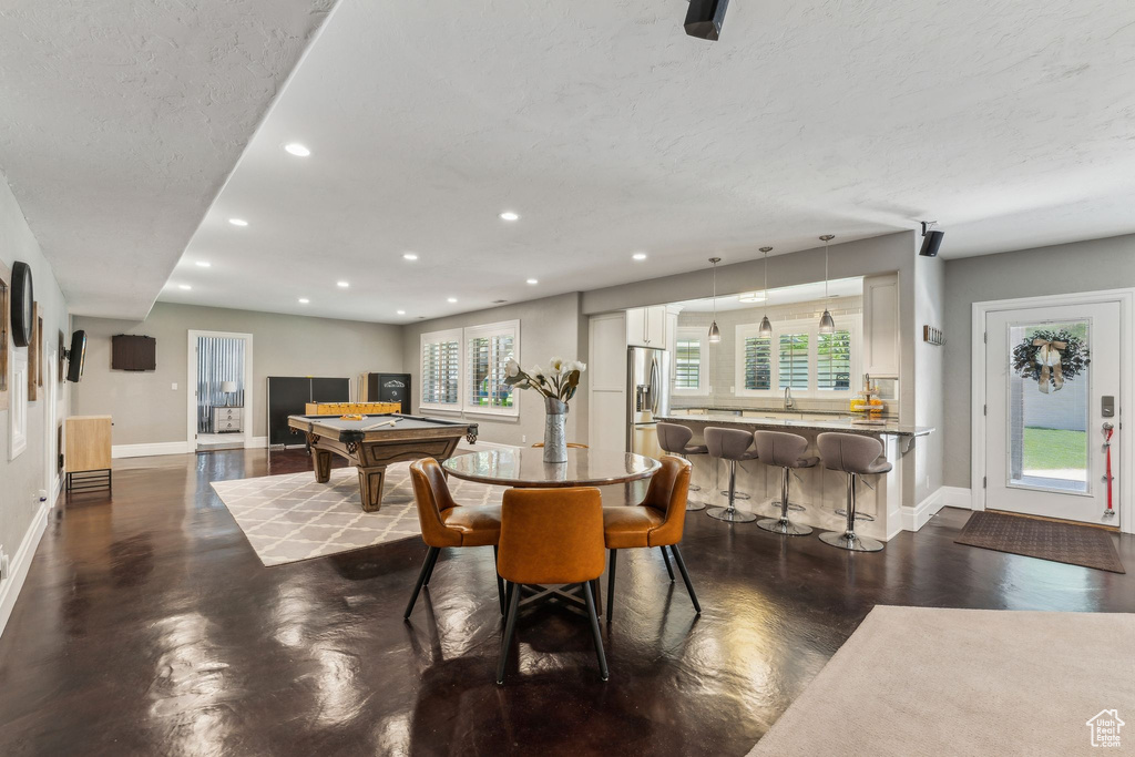 Dining room featuring billiards, baseboards, recessed lighting, and a textured ceiling