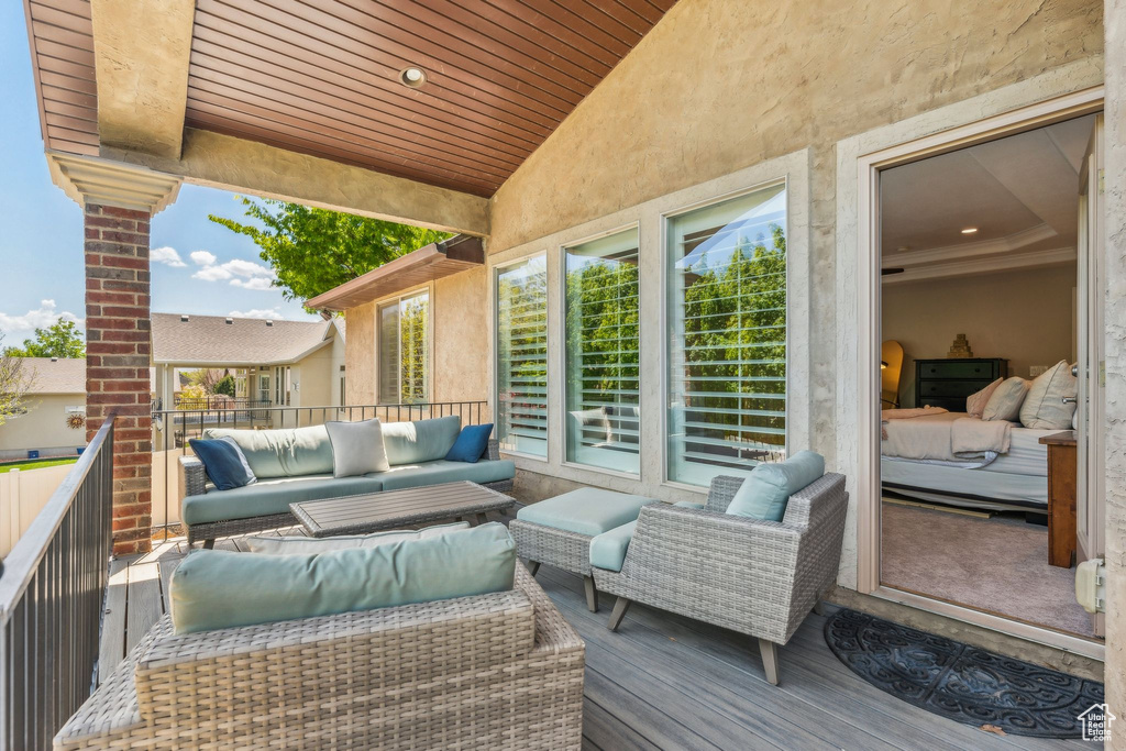 Wooden deck featuring outdoor lounge area