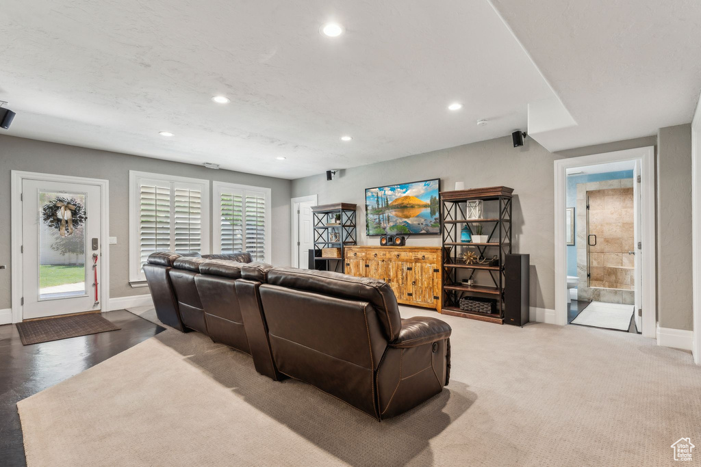 Living area with recessed lighting and baseboards