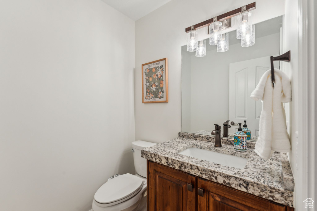 Bathroom with vanity and toilet