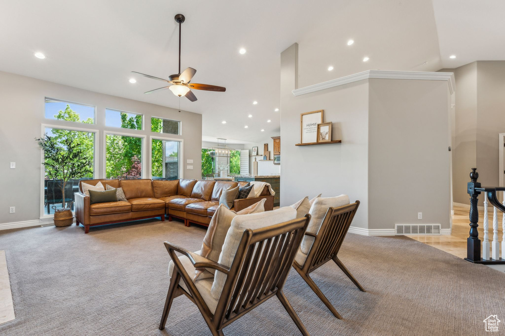 Living area featuring ceiling fan, light colored carpet, recessed lighting, and visible vents