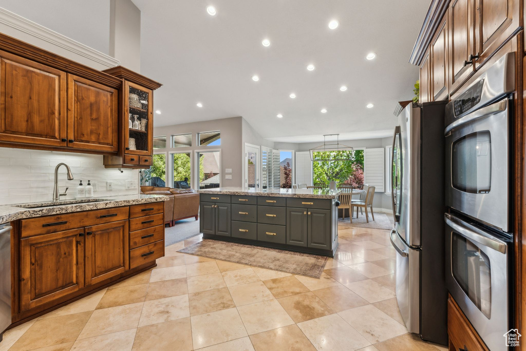 Kitchen featuring recessed lighting, a sink, appliances with stainless steel finishes, and a healthy amount of sunlight