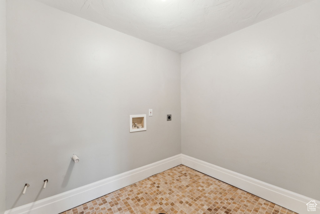 Washroom with laundry area, hookup for a washing machine, baseboards, and electric dryer hookup