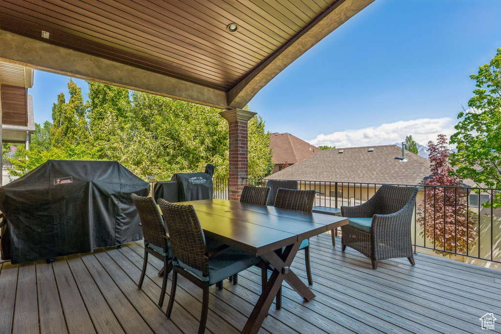 Wooden terrace with a grill