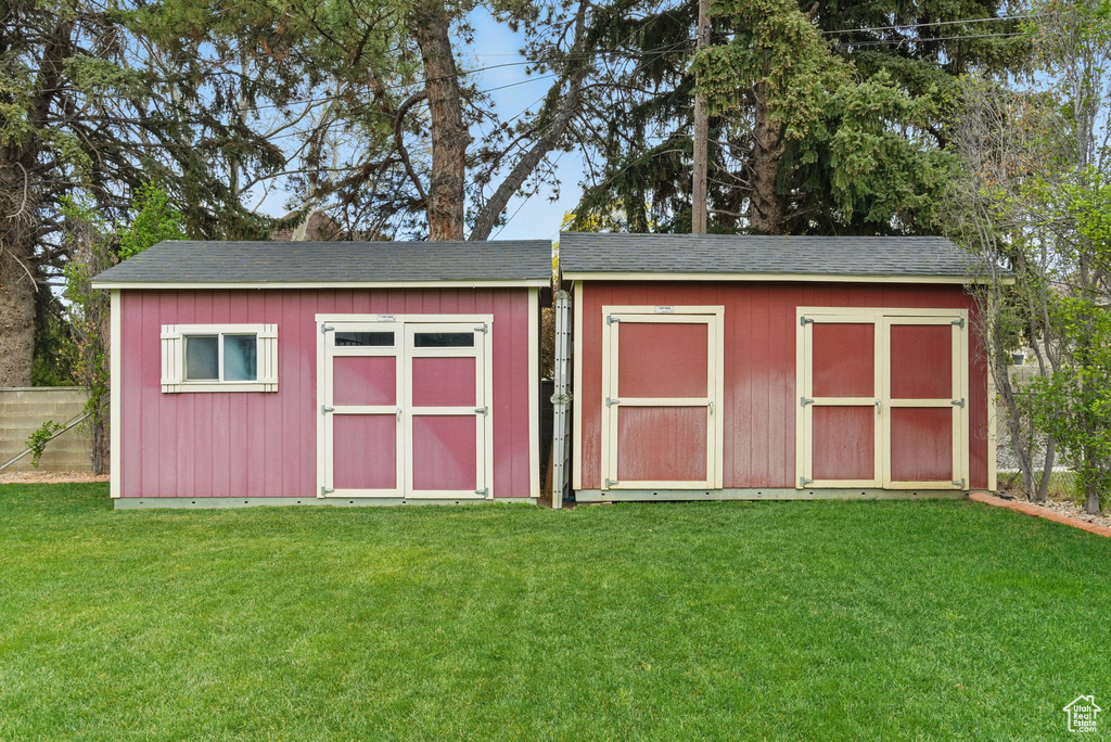 View of shed with fence