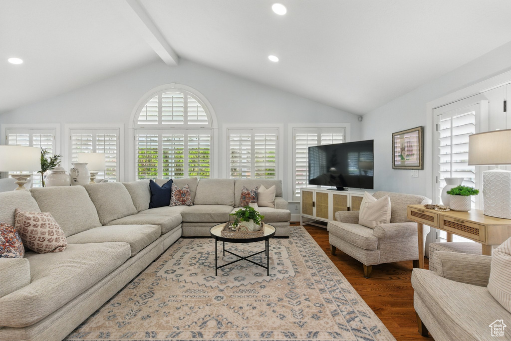 Living room featuring recessed lighting, lofted ceiling with beams, and dark wood-style flooring
