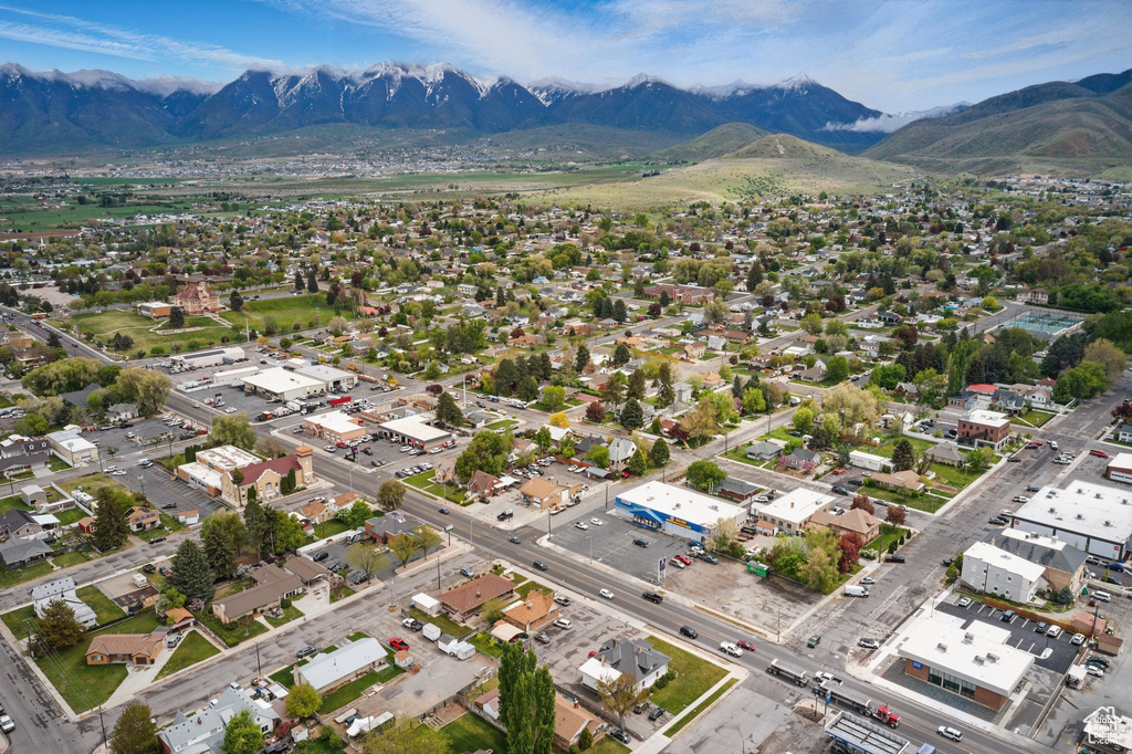 Birds eye view of property with a mountain view