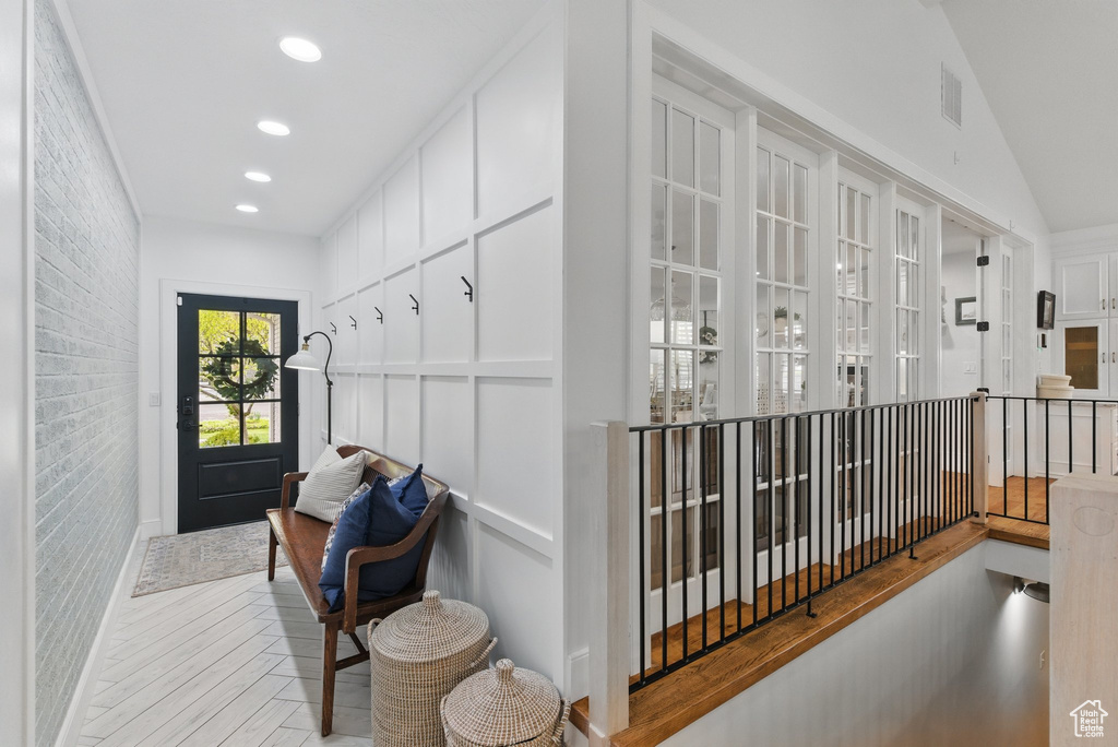 Hall featuring visible vents, recessed lighting, and wood finished floors