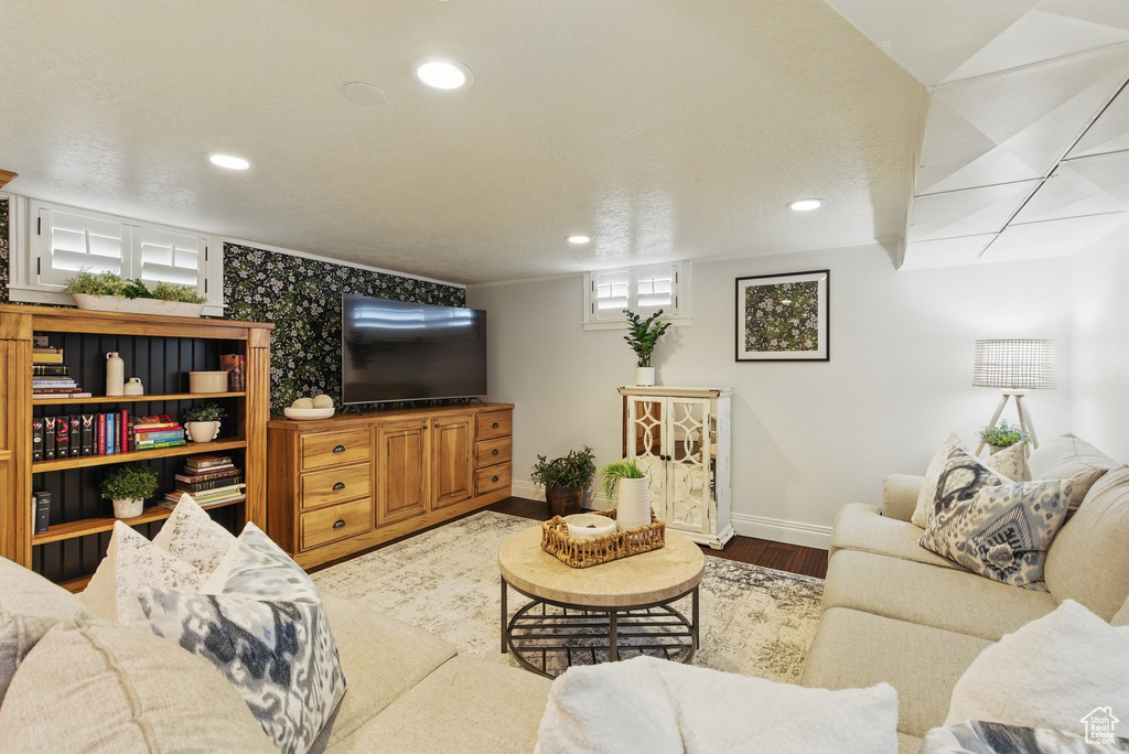 Living area with recessed lighting, baseboards, and wood finished floors