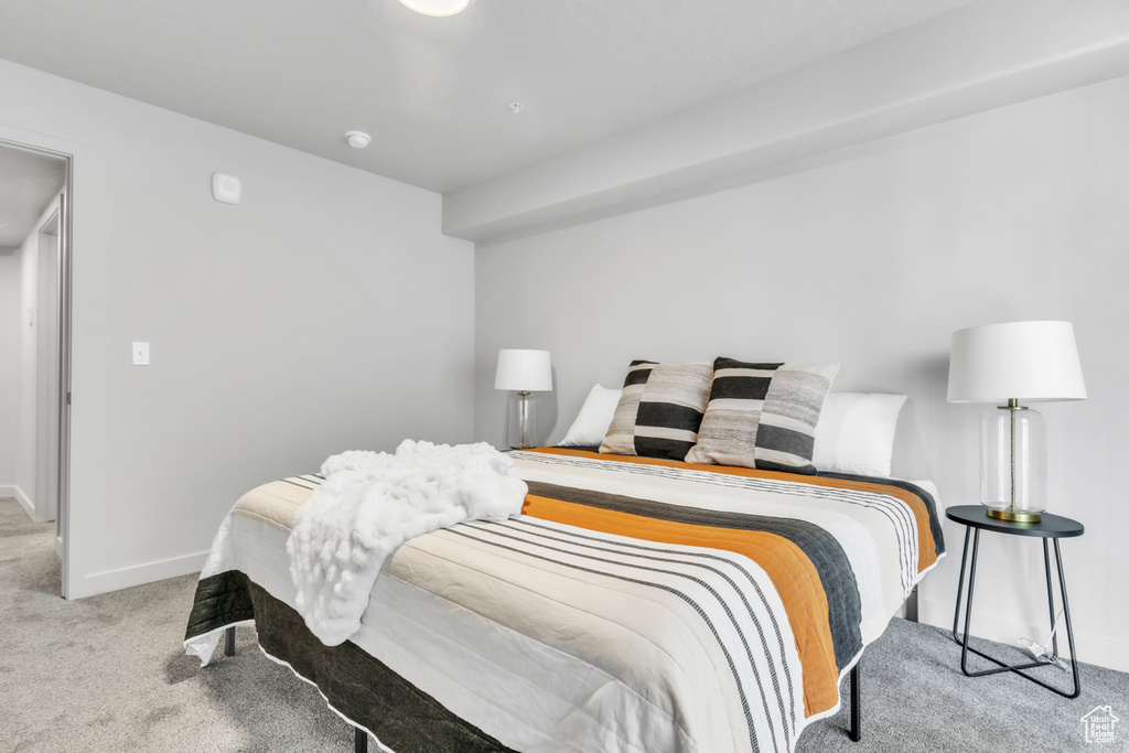 Carpeted bedroom with baseboards