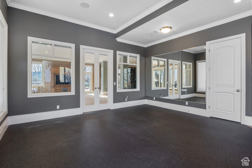 Unfurnished room with recessed lighting, baseboards, ornamental molding, and french doors
