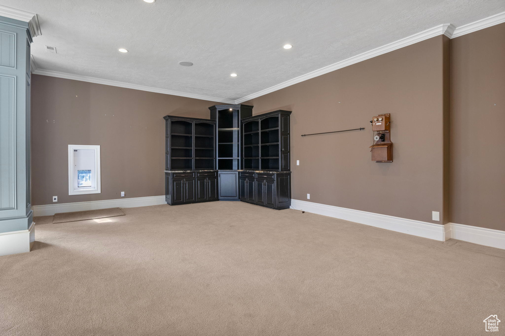 Empty room with recessed lighting, baseboards, and light carpet