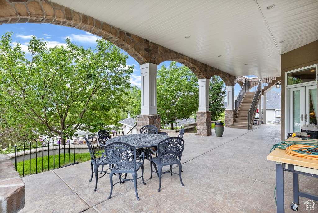 View of patio / terrace featuring stairway and outdoor dining space