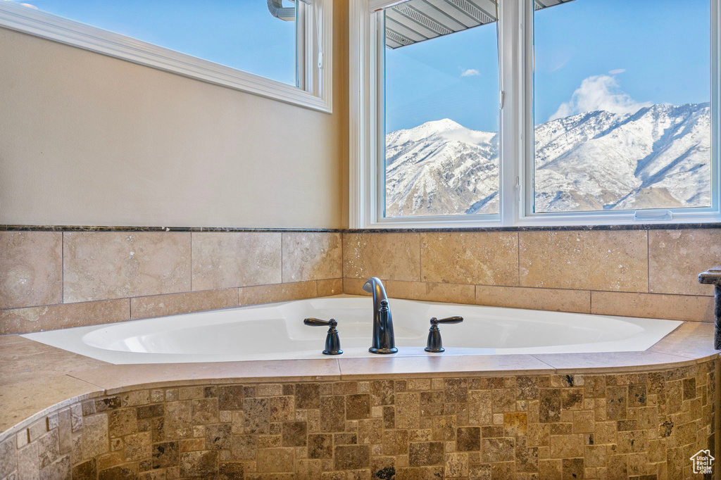 Bathroom with a mountain view and a garden tub