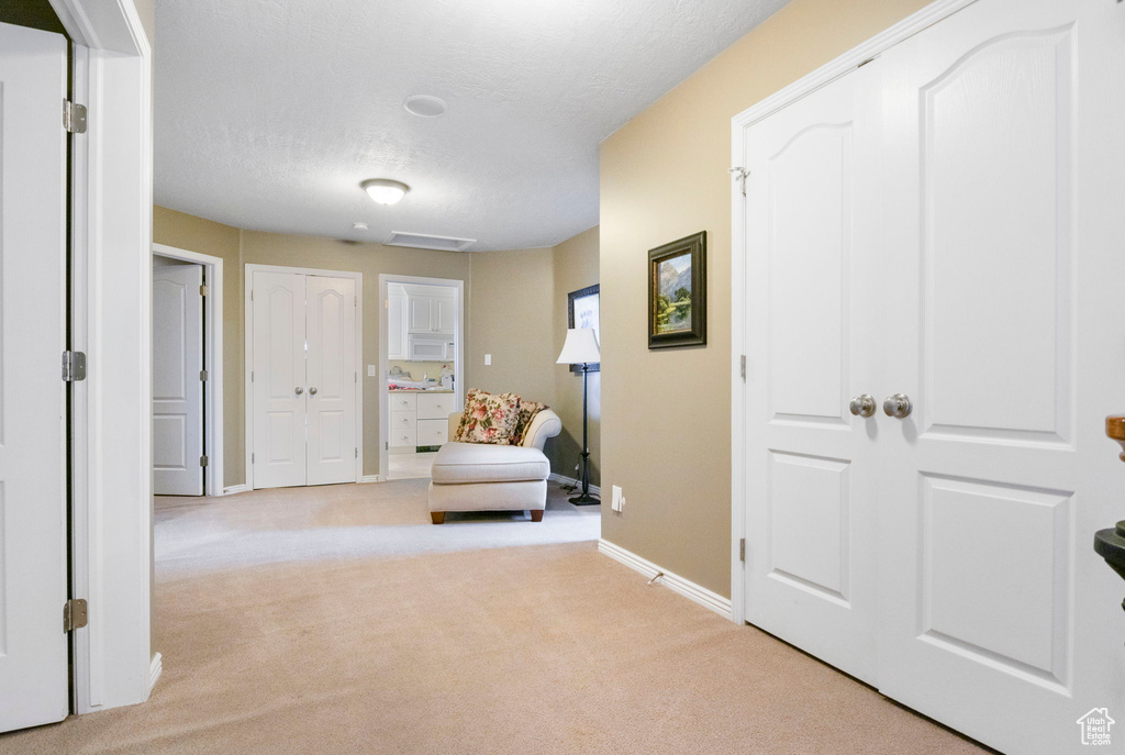 Living area with carpet floors and baseboards