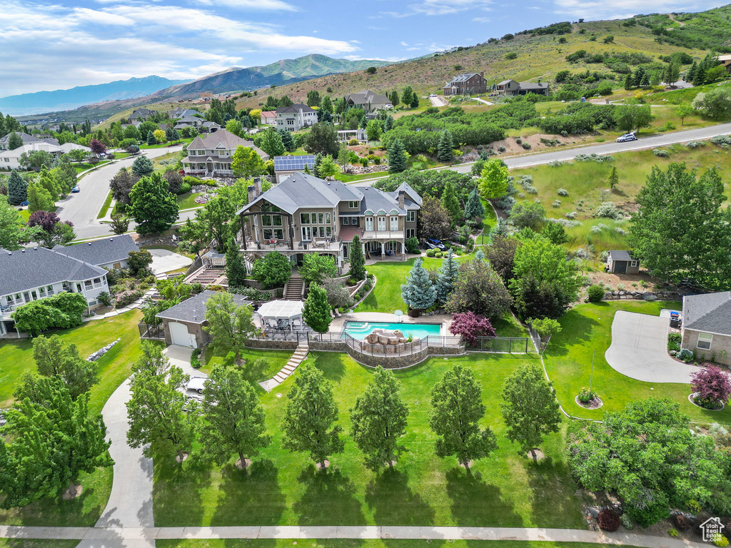 Drone / aerial view with a residential view and a mountain view