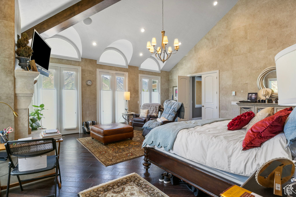 Bedroom with high vaulted ceiling, an inviting chandelier, access to outside, recessed lighting, and hardwood / wood-style floors