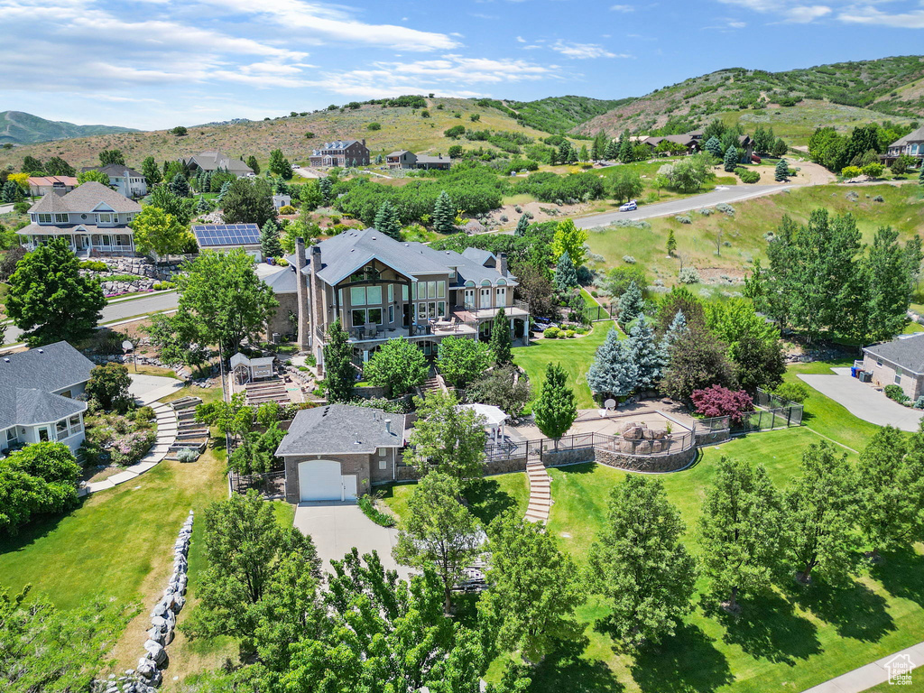 Drone / aerial view featuring a mountain view and a residential view