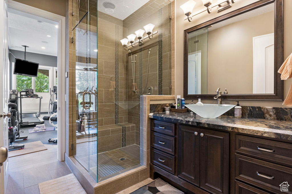 Full bath with vanity, a shower stall, and recessed lighting