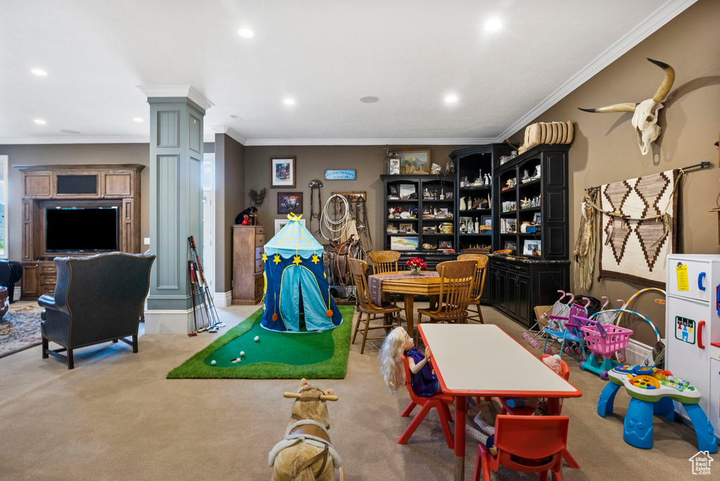 Game room with crown molding, carpet floors, decorative columns, and recessed lighting