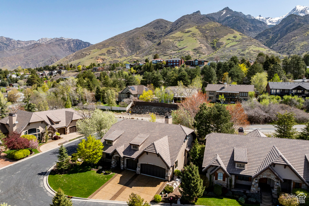 Birds eye view of property with a residential view and a mountain view