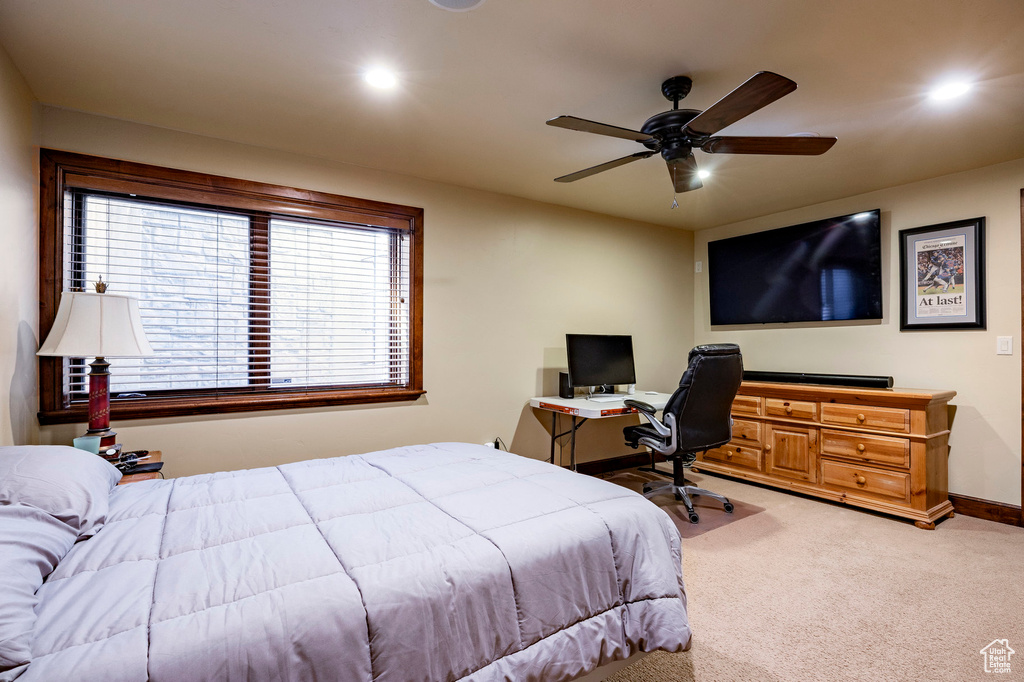 Carpeted bedroom featuring recessed lighting, baseboards, and ceiling fan